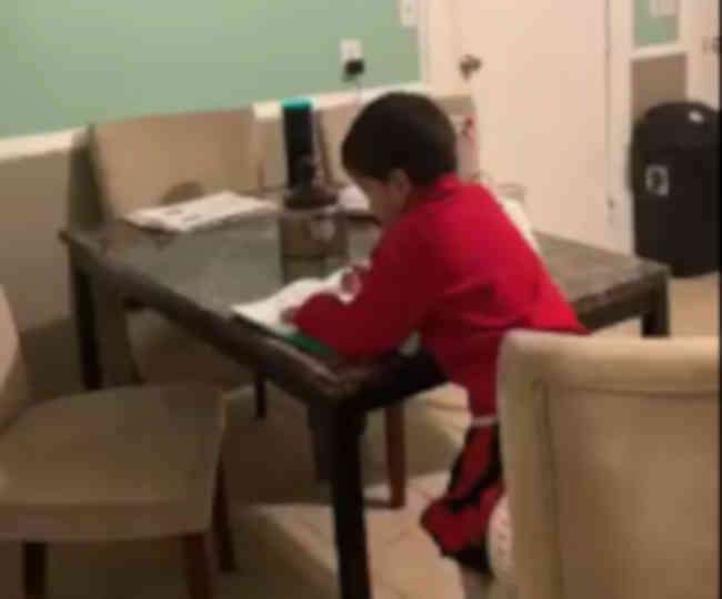 smart-american-six-year-kid-using-alexa-to-do-his-